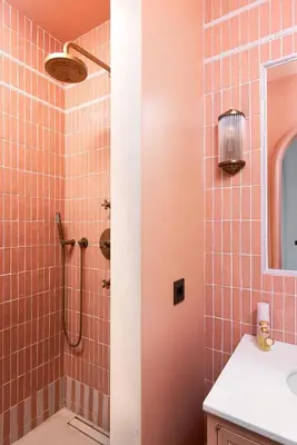 a bathroom with a shower with pink tiles at Idyllia - Casa Mina in Rome