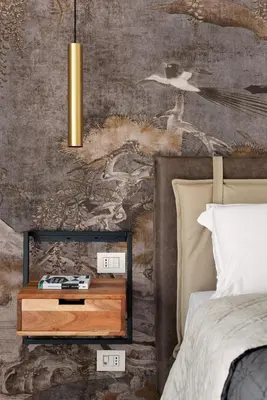 a bedroom with a bed and a nightstand next to a bed sidx sidx sidx at Idyllia - Borgognona luxury home in Rome