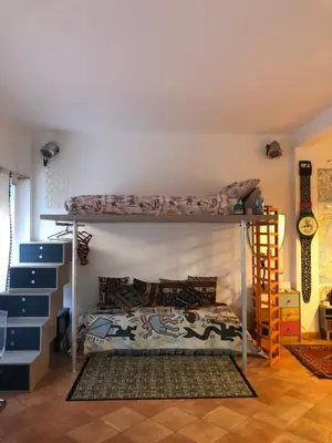 a bedroom with two bunk beds in a room at A CASA di BICE in Rome