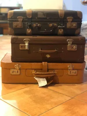 three suitcases stacked on top of each other on the floor at A CASA di BICE in Rome