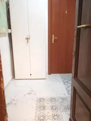 a hallway with a door and a tile floor at Arneil Rooms Rome in Rome