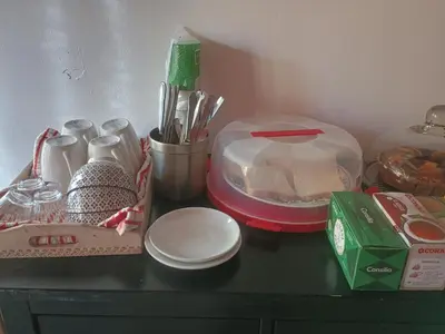 a table with dishes and utensils on it at Arneil Rooms Rome in Rome