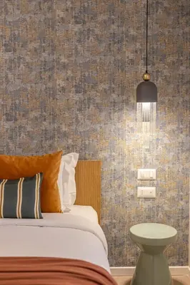 a bedroom with a bed and a pendant light at BDC - Roman Lounge 3BDR at Vatican in Rome