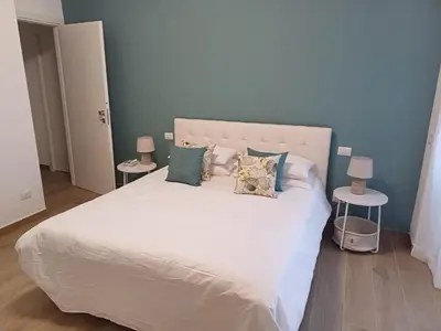a bedroom with a large white bed with pillows at Ascenza in Trasteverere in Rome
