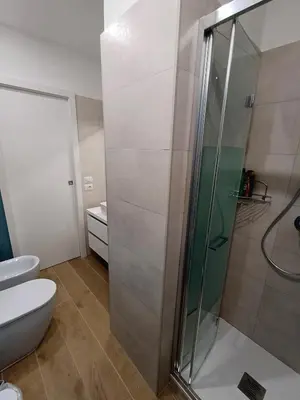 a bathroom with a shower and a toilet at Ascenza in Trasteverere in Rome