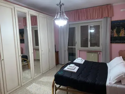 a bedroom with a bed with two towels on it at Millys Apartment Rome Centre 