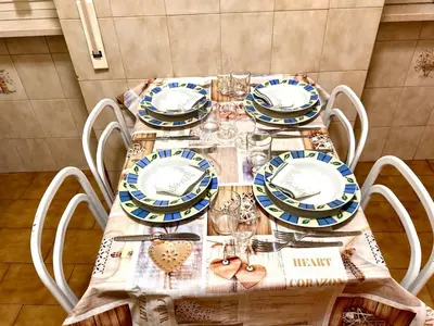 a table with plates and dishes on top of it at Millys Apartment Rome Centre 