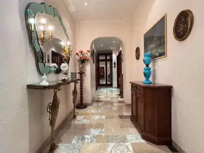 a hallway of a home with a mirror on the wall at Millys Apartment Rome Centre 
