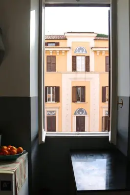 a window with a view of a building at Tra i Musei Vaticani House in Rome