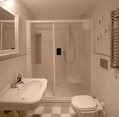 a bathroom with a shower and a sink and a toilet at Apartment Ripa 17 in Rome
