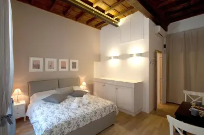 a bedroom with a bed with two teddy bears on it at Apartment Ripa 17 in Rome