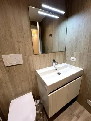 a bathroom with a sink and a toilet and a mirror at ARTPA Rome Apartments Trastevere Mameli, Roma in Rome