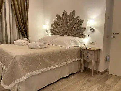 a bedroom with a bed with two towels on it at ARTPA Rome Apartments Trastevere Mameli, Roma in Rome