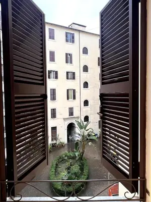 a view of a building from a window at ARTPA Rome Apartments Trastevere Mameli, Roma in Rome