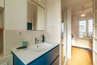 a bathroom with a sink and a mirror at Terrazza d'autore in Rome