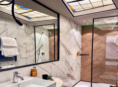 a bathroom with a sink and a shower at Z-ArchSuites URBE in Rome