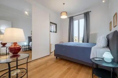 a bedroom with a bed and a couch at ht siesta sistina in Rome