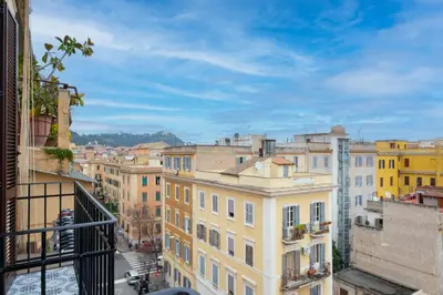 a view of a city from the balcony of a building at ht siesta sistina in Rome