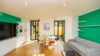 a living room with a couch and a tv at Villa Paolina by Rentbeat in Rome
