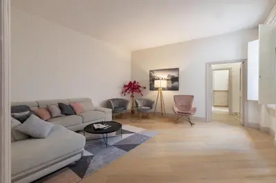 a living room with a couch and a table at Roma - Parione House in Rome