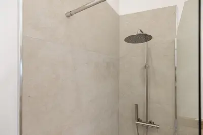 a shower with a glass door in a bathroom at Roma - Parione House in Rome