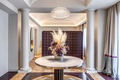 a living room with a table and a couch at Dimora Coppelle - Adults Only in Rome