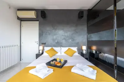 a bedroom with a bed with a tray of food on it at Stella su San Pietro in Rome