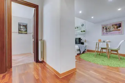 a living room with a sliding door and a table at Colosseo - MecenStudio - Home and More in Rome
