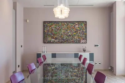 a conference room with a glass table and purple chairs at Vatican Exclusive Penthouse w Terrace and Parking in Rome