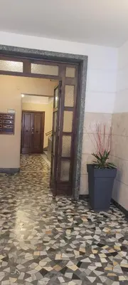 an open door to a room with a potted plant at A casa di Fede b&b in Rome
