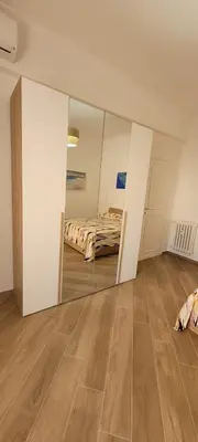 a mirror in a room with a bed at A casa di Fede b&b in Rome