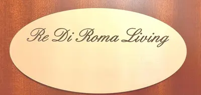 a sign that reads he irmana living on a door at Re di Roma Living in Rome