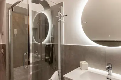 a bathroom with a sink and a mirror at Domus Vespignani in Metro Lodi e San Giovanni - The Bright Spot in Rome