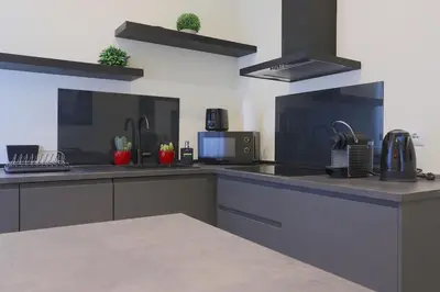 a kitchen with a sink and a counter top at Domus Vespignani in Metro Lodi e San Giovanni - The Bright Spot in Rome