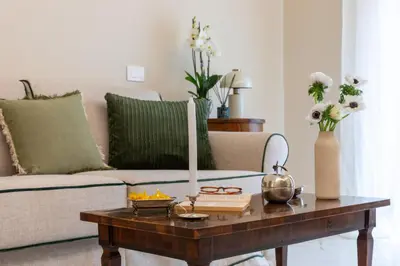 a living room with a coffee table and a couch at Casa Green by Hili in Rome