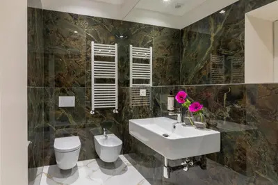 a bathroom with a sink and a toilet at Casa Green by Hili in Rome