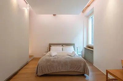 a bedroom with a bed with two towels on it at Coronari Navona luxury 1 bedroom 2 bathrooms in Rome