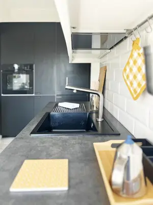 a kitchen with a sink and a counter top at Yellow Sweet Home in Rome