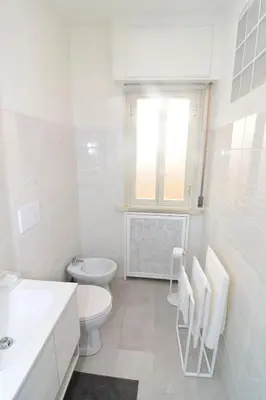 a bathroom with a shower and a toilet and a sink at Roma Metro Apartment in Rome