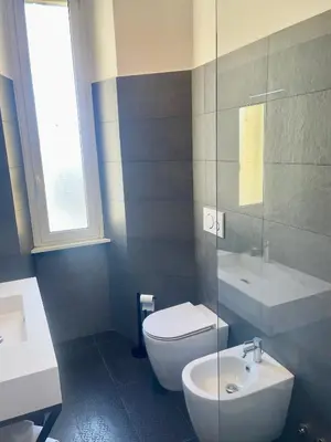 a bathroom with a toilet and a sink at Palmira house in Rome