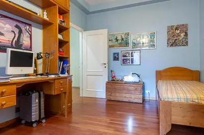 a bedroom with a desk with a computer and a bed at Camilluccia Home close to St Peter Stadio Olimpico in Rome