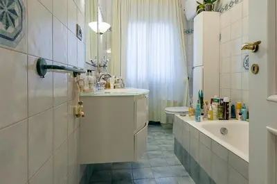 a bathroom with a sink and a toilet at Camilluccia Home close to St Peter Stadio Olimpico in Rome