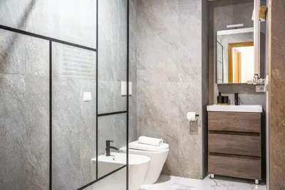 a bathroom with a toilet and a sink at Eco Retreat -Sauna & Garden in Rome