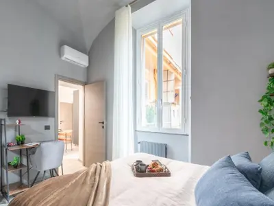 a bedroom with a bed with a bowl of fruit on it at The Best Rent - Modern One-Bedroom Apartment in Trastevere in Rome