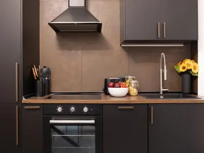a kitchen with a stove and a sink with a bowl of fruit at The Best Rent - Modern One-Bedroom Apartment in Trastevere in Rome