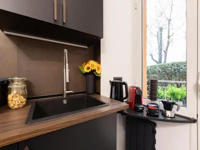 a kitchen with a sink and a window at The Best Rent - Modern One-Bedroom Apartment in Trastevere in Rome