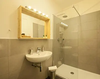 a bathroom with a sink and a shower at Relais Quattro Fontane in Rome