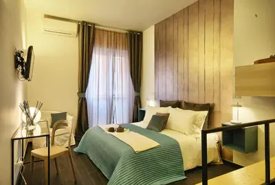 a hotel room with a bed and a window at Relais Quattro Fontane in Rome