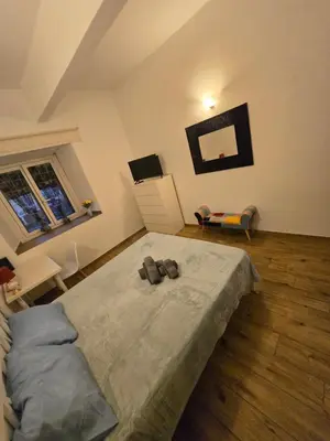 a bedroom with a bed and a desk in it at Casa in Rome