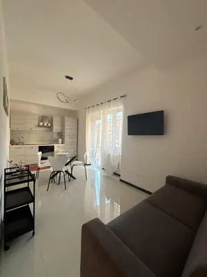 a living room with a couch and a table at 612 Flats in Rome